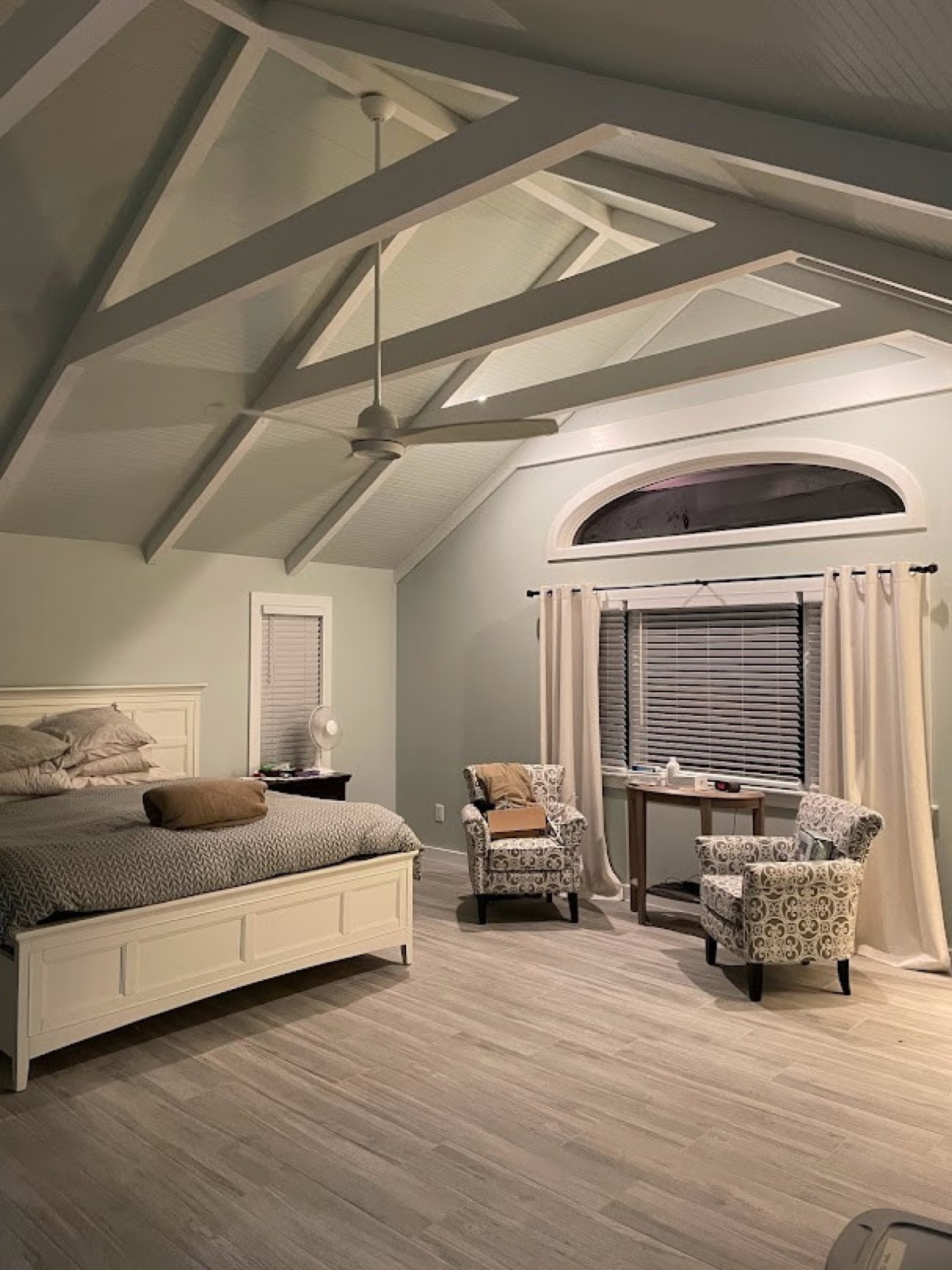 Full room renovation with vaulted ceiling and exposed beam work