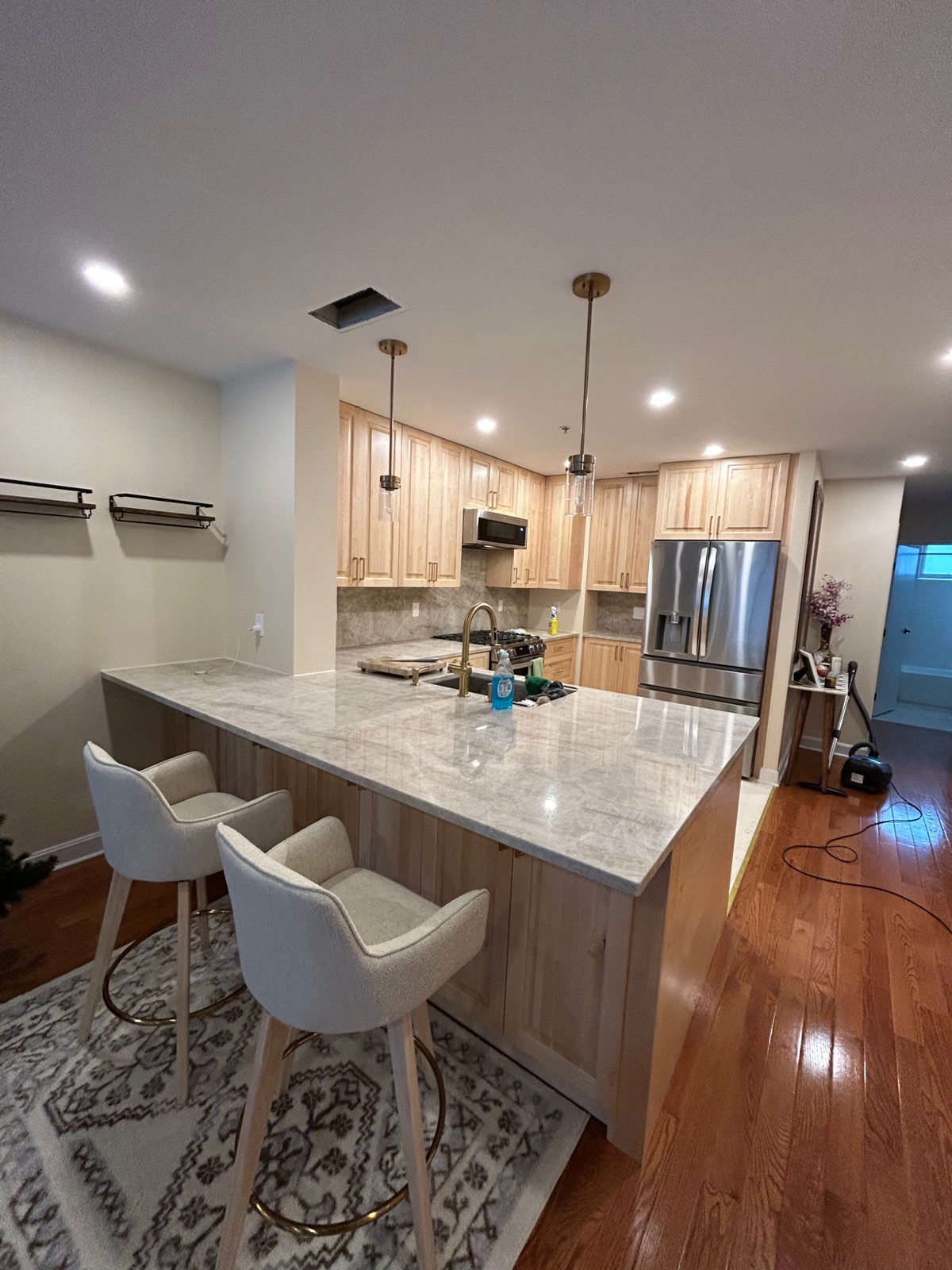 Custom kitchen remodel with maple cabinets and stone countertops